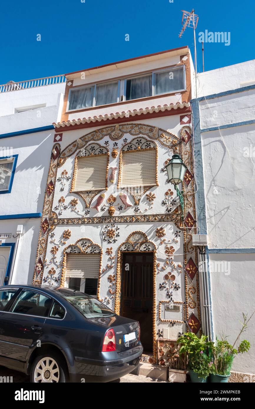 House In Old Town Albufeira With Exterior Walls Decorated With Seashells, Albufeira Old Town, Portugal, February 20, 2024 Stock Photo
