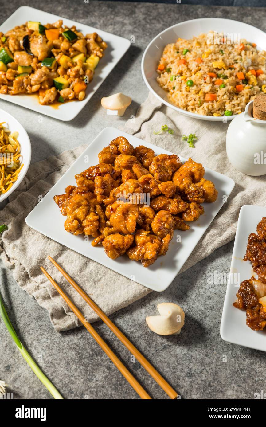 Chinese Fast Food Meal with Fried Rice Orange Chicken and Kung Pao Stock Photo