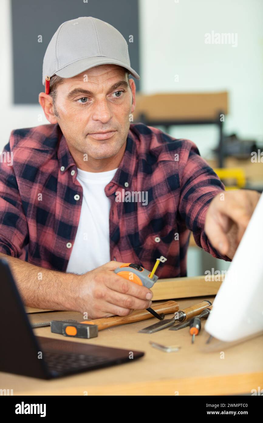 senior man using computer on work table Stock Photo