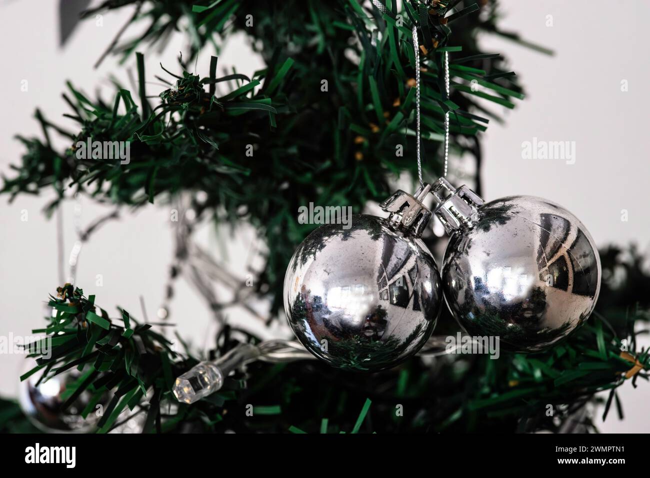 Three silver baubles hanging from a Christmas tree branch Stock Photo ...