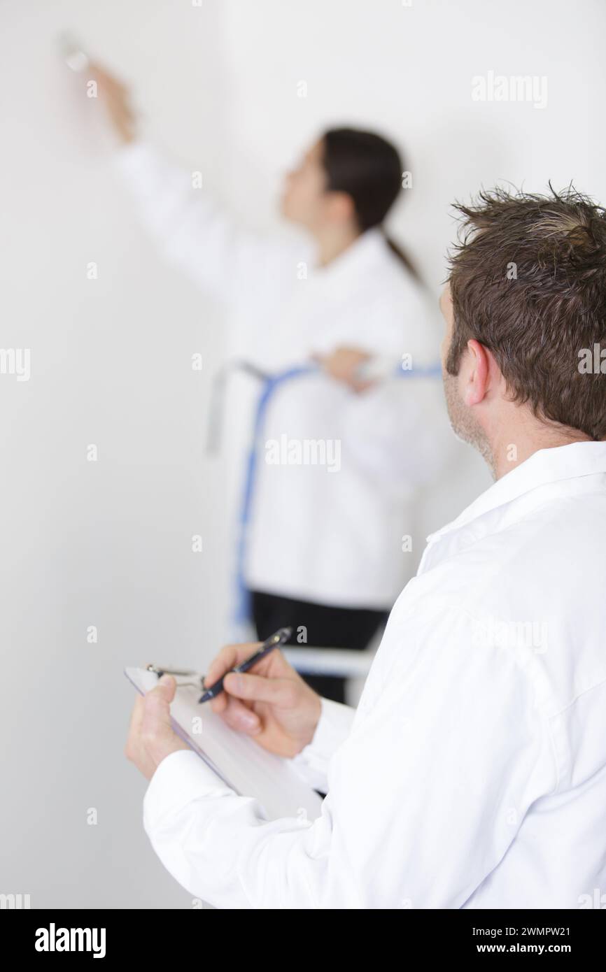 workers discuss renovation project using digital tablet Stock Photo