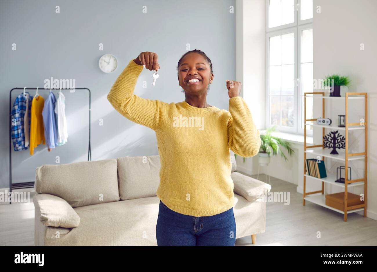 Happy smiling african young woman home hi-res stock photography and ...