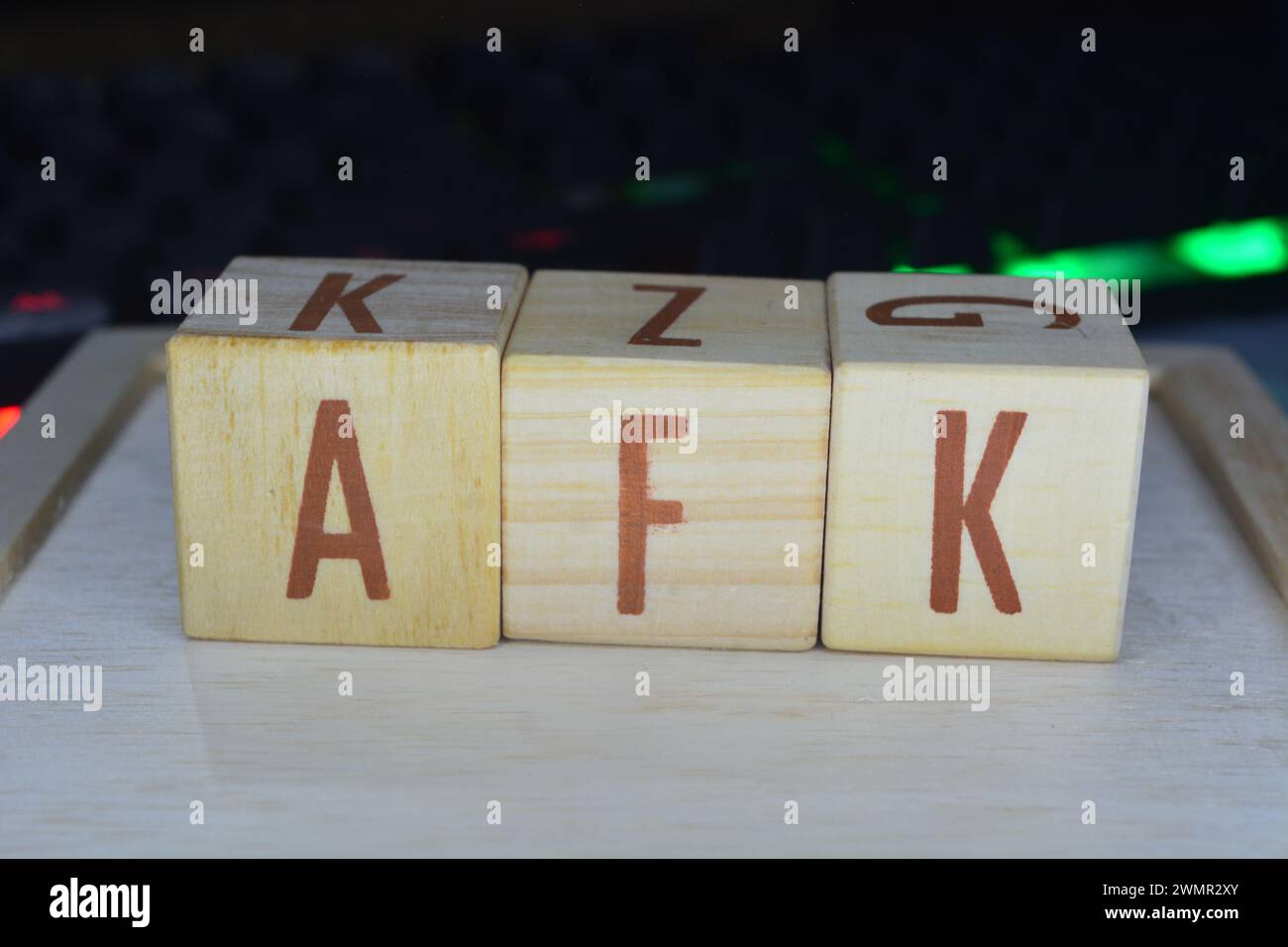 Photo of wooden blocks that make up the vocabulary 'AFK' in English Stock Photo