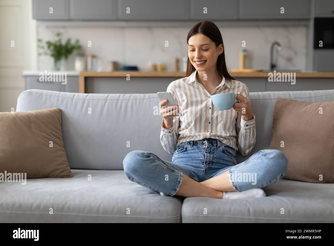 Relaxed woman coffee smartphone hi-res stock photography and images - Alamy