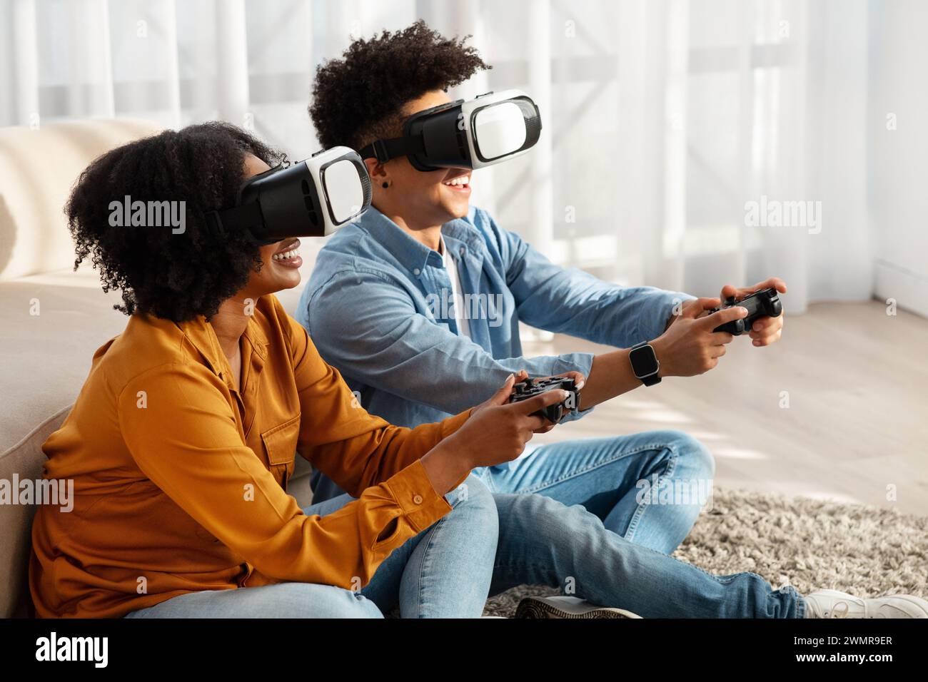 Couple immersed in virtual hi-res stock photography and images - Alamy