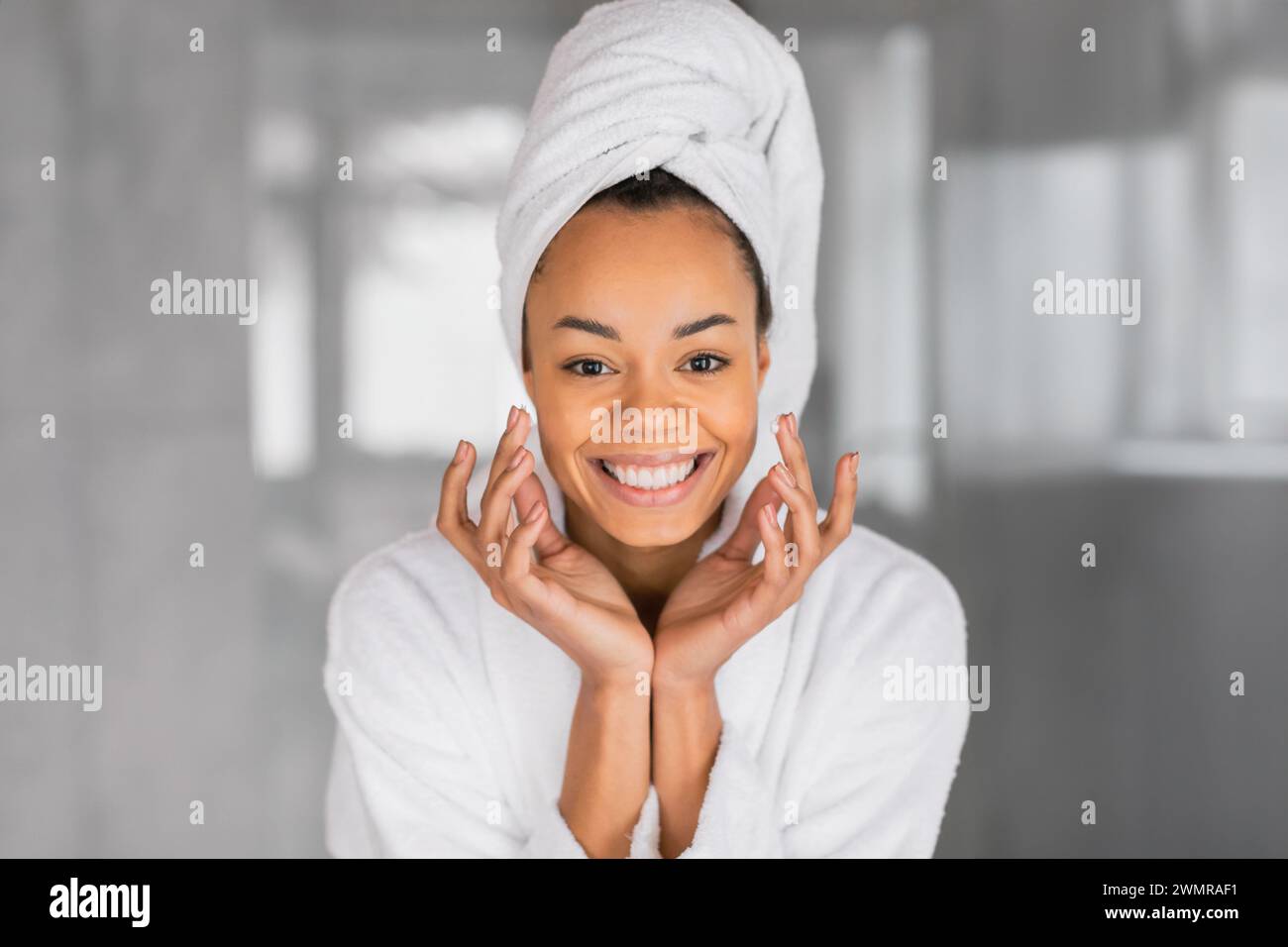 Young woman in bathrobe applies hi-res stock photography and images - Alamy
