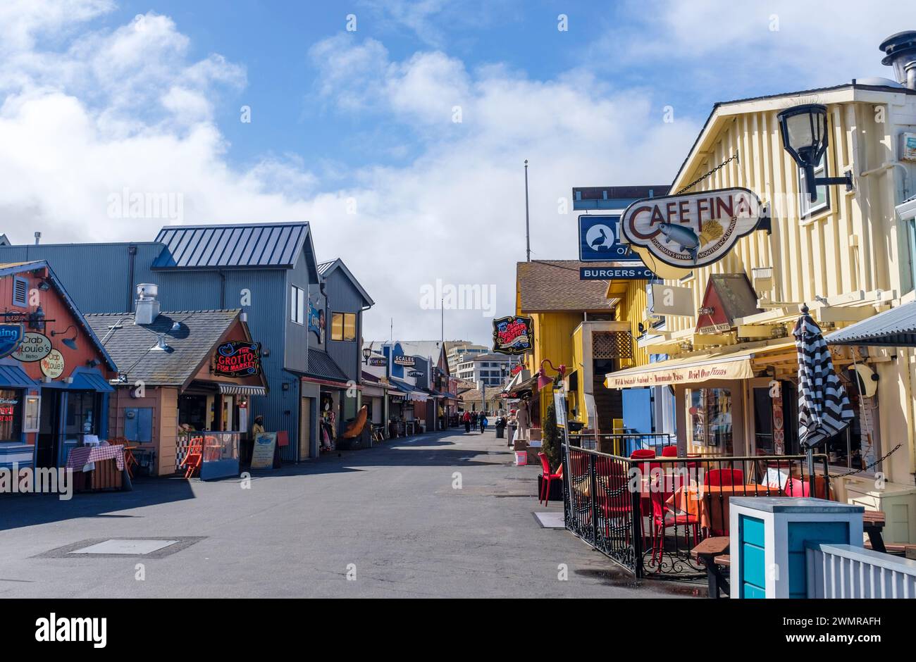 Bright and colourful morning quiet on the old Monterey fisherman's wharf where restaurants and gift shops open for business. Stock Photo