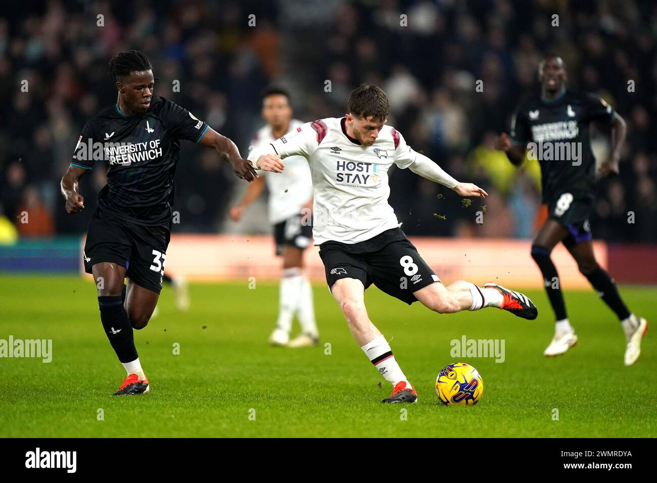 Derby County's Max Bird (centre) and Charlton Athletic's Karoy Anderson (left) battle for the ball during the Sky Bet League One match at Pride Park, Derby. Picture date: Tuesday February 27, 2024. Stock Photo