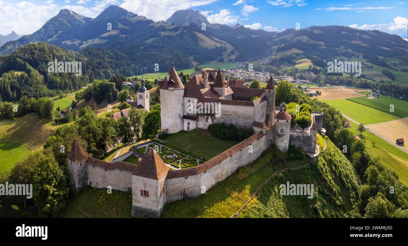 Switzerland travel and landmarks. scenic medieval village and castle Gruyere. canton Fribourg. Aerial drone video Stock Photo