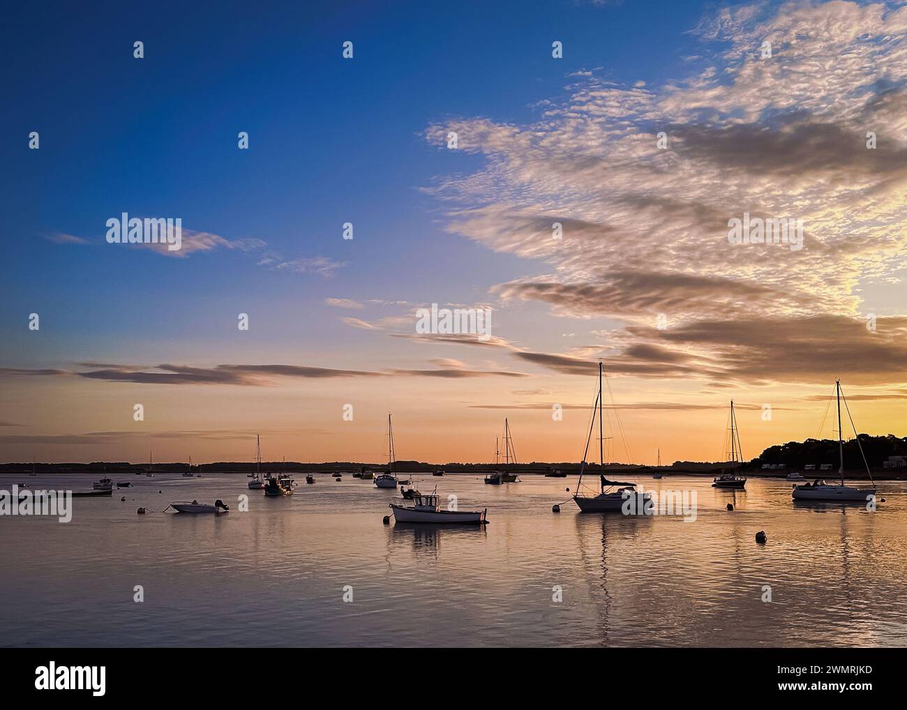 Sunrise in Suffolk - a tranquil start to the dat at Felixstowe Ferry Stock Photo