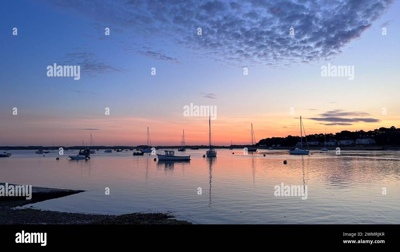 Sunrise in Suffolk - a tranquil start to the dat at Felixstowe Ferry Stock Photo