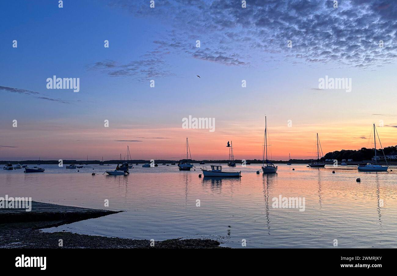 Sunrise in Suffolk - a tranquil start to the dat at Felixstowe Ferry Stock Photo