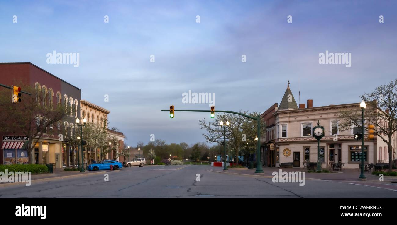 Dawn breaks over the Dexter clock tower and city center, Michigan Stock Photo