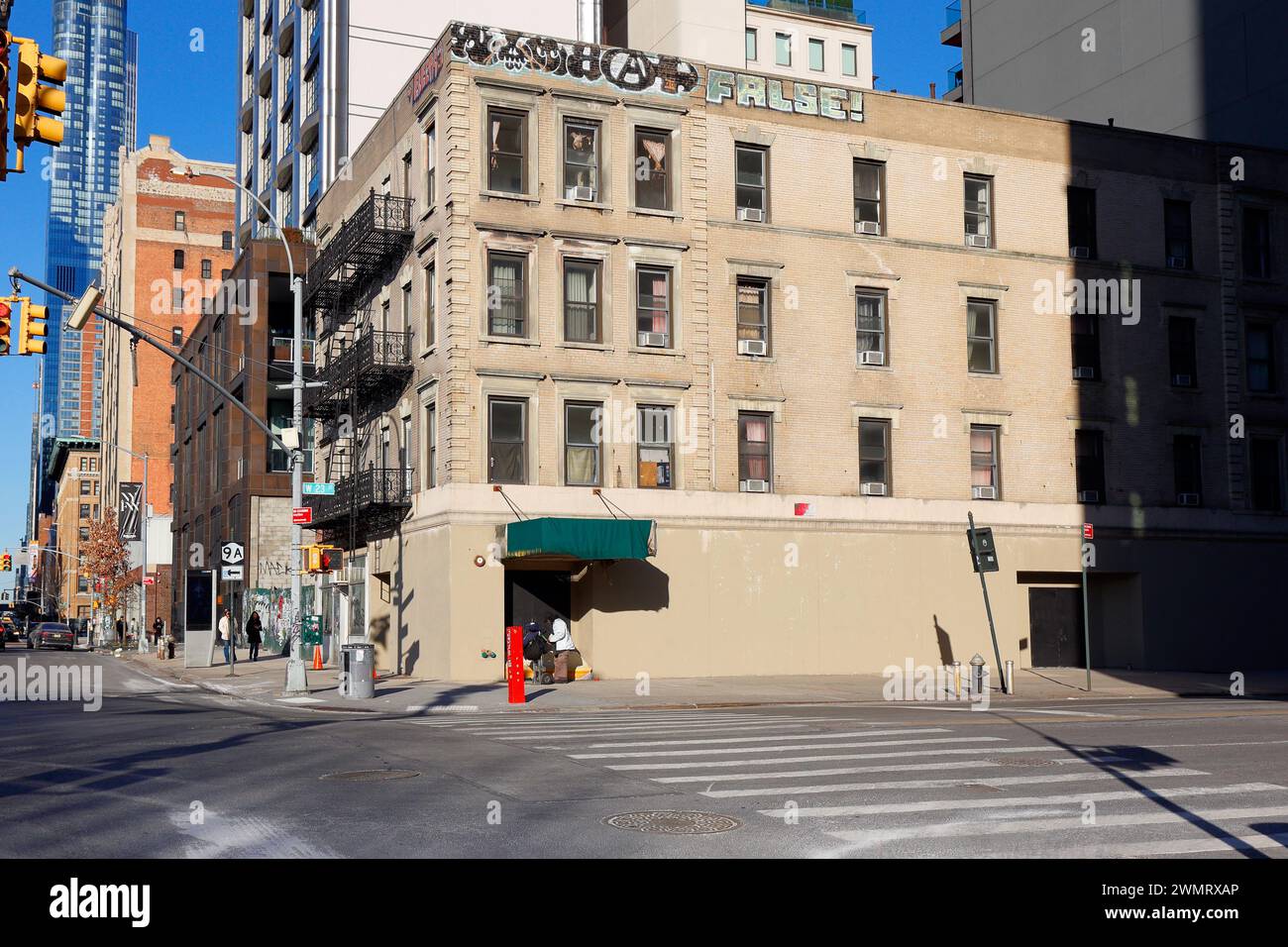 182-184 11th Ave, 565 W 23rd St, New York, NY. exterior of a former single occupancy hotel, SRO in Manhattan's West Side. Stock Photo