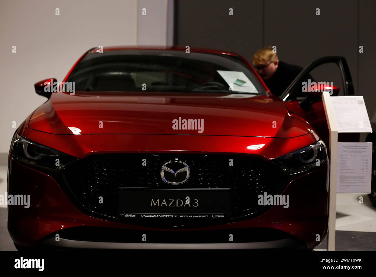 Mazda 3 seen during automobile Exhibition in Giessen Hessenhallen. Stock Photo