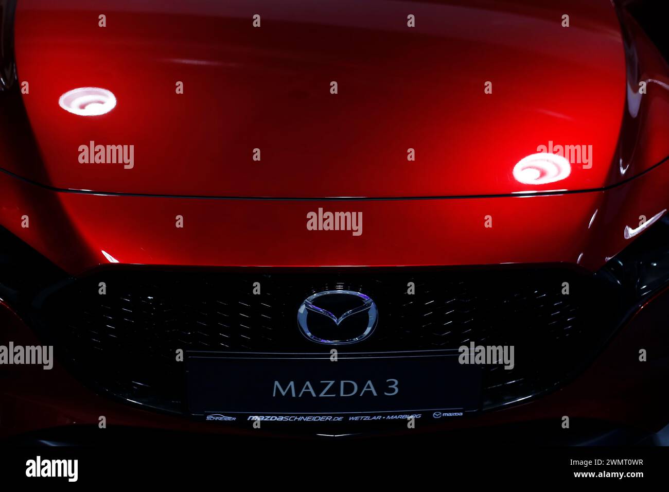 Mazda 3 seen during automobile Exhibition in Giessen Hessenhallen. Stock Photo