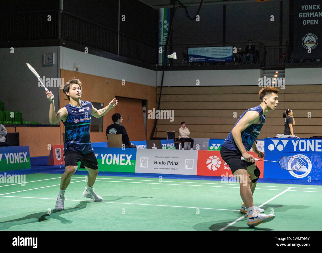 Muelheim, Germany. 27th Feb, 2024. Ong Yew Sin/Teo Ee Yi (L) of Malaysia compete during the men's doubles first round match between Ong Yew Sin/Teo Ee Yi of Malaysia and Eloi Adam/Leo Rossi of France at Yonex German Open 2024 badminton tournament in Muelheim, Germany, Feb. 27, 2024. Credit: Zhang Fan/Xinhua/Alamy Live News Stock Photo