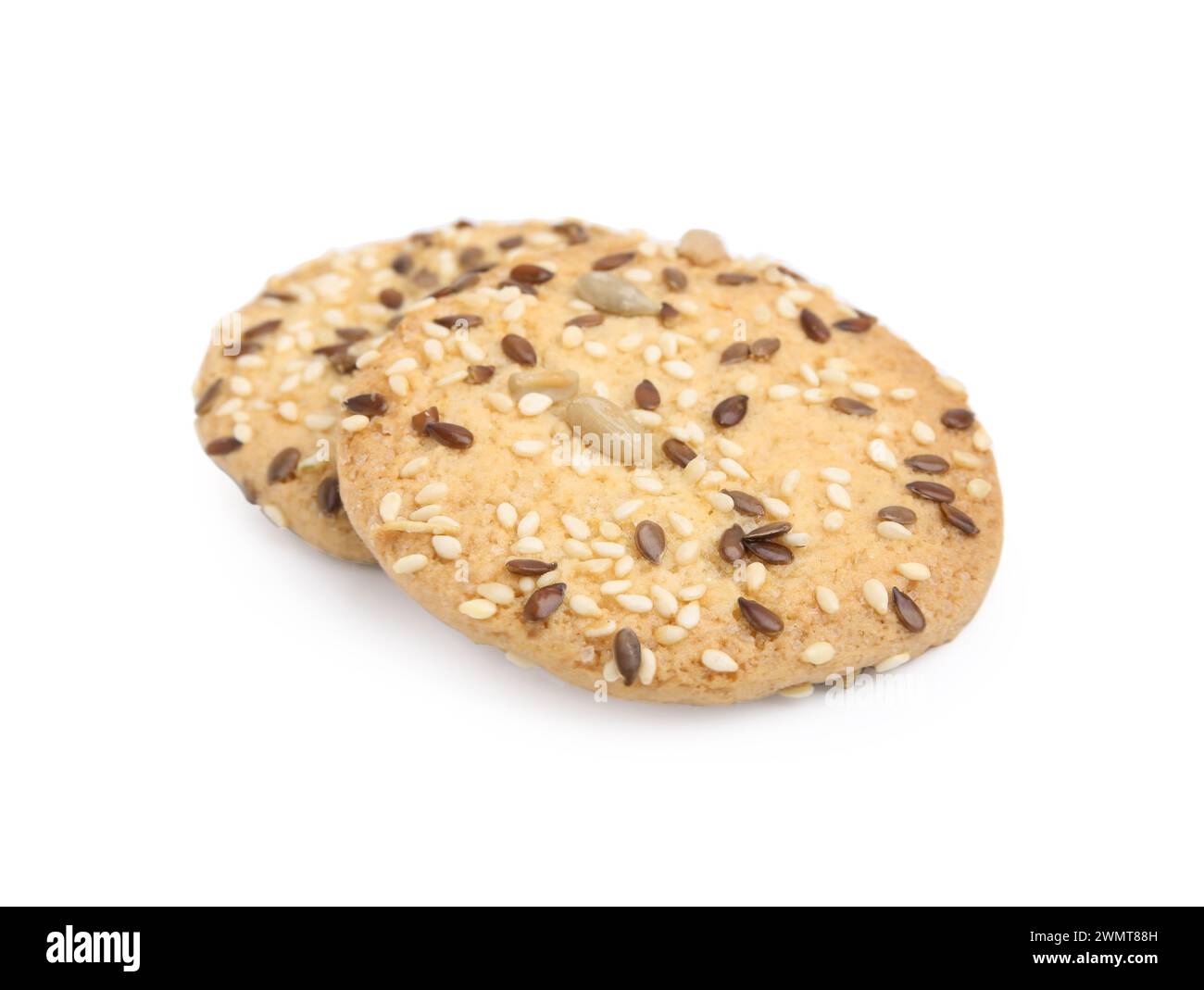 Round cereal crackers with flax, sunflower and sesame seeds isolated on ...