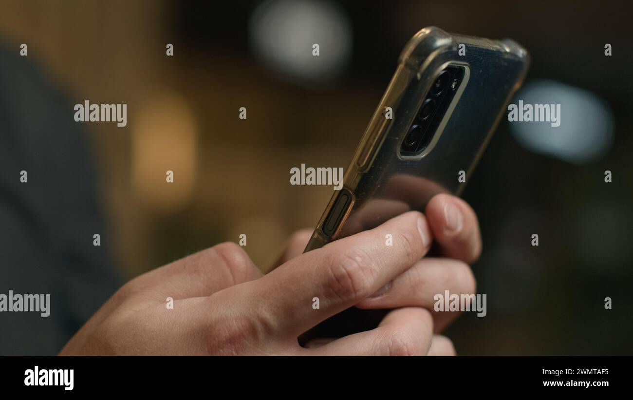 Close-up male hands chatting cellphone screen typing message touchscreen on mobile phone unrecognizable man businessman texting smartphone make online Stock Photo