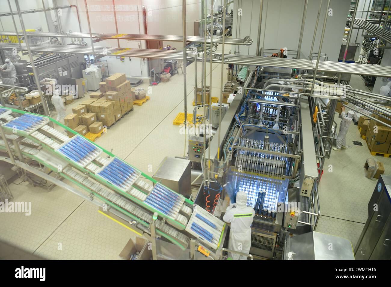 TAICANG, CHINA - FEBRUARY 27, 2024 - Workers work on the production line at the world's first ice cream "Lighthouse Network" Unilever Wall's productio Stock Photo