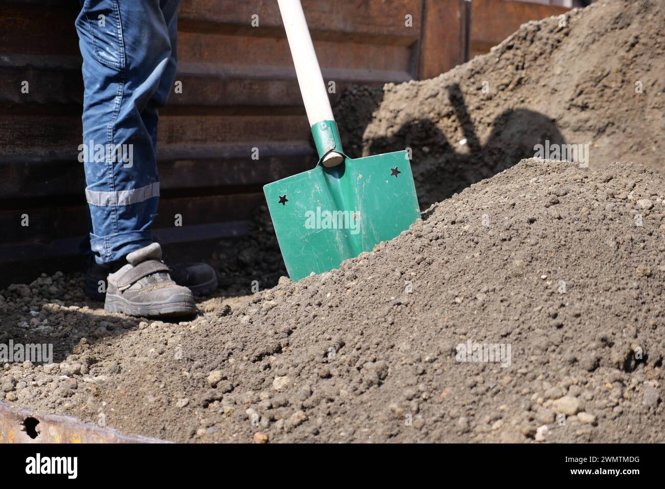a man digs his spring garden with an old shovel. Stock Photo