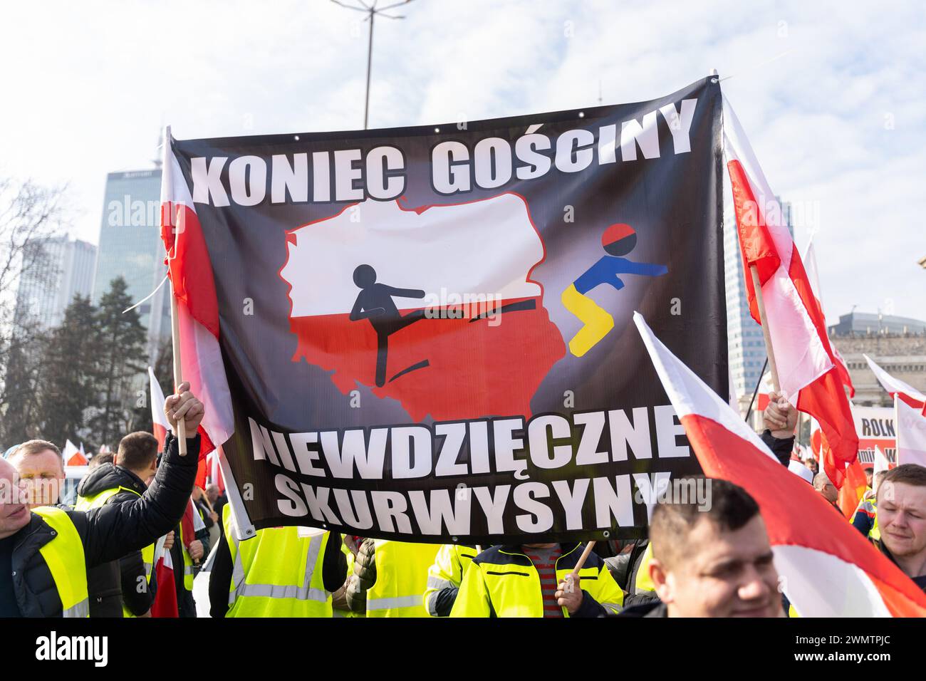 Protesters hold an anti-Ukrainian banner that says 'No more hospitality, you ungrateful bastards' during a demonstration. Farmers rallied in the heart of Warsaw to voice their discontent with the agricultural policies of the European Union. Polish farmers strongly oppose the European Commission's recent move to prolong duty-free trade with Ukraine until 2025. Additionally, they are opposed to the adoption of the EU's Green Deal, the influx of inexpensive agricultural goods from Ukraine, and are calling for assistance in bolstering animal husbandry. During the protest, farmers set off flares, i Stock Photo