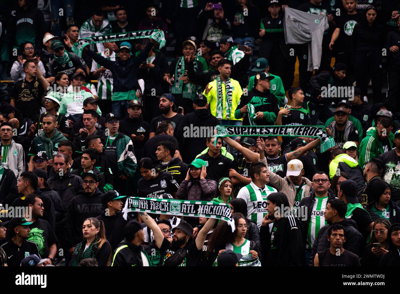 Bogota, Colombia. 25th Feb, 2024. Fans of Nacional hold scarfs with messages during the BetPlay Dimayor Leagua match between Equidad (2) and Nacional (0) in Bogota, Colombia's El Campin stadium on February 25, 2024. Photo by: Sebastian Barros/Long Visual Press Credit: Long Visual Press/Alamy Live News Stock Photo