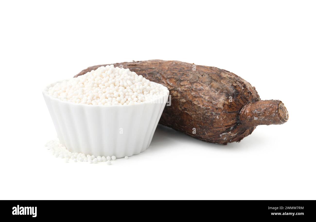 Tapioca pearls in bowl and cassava root isolated on white Stock Photo