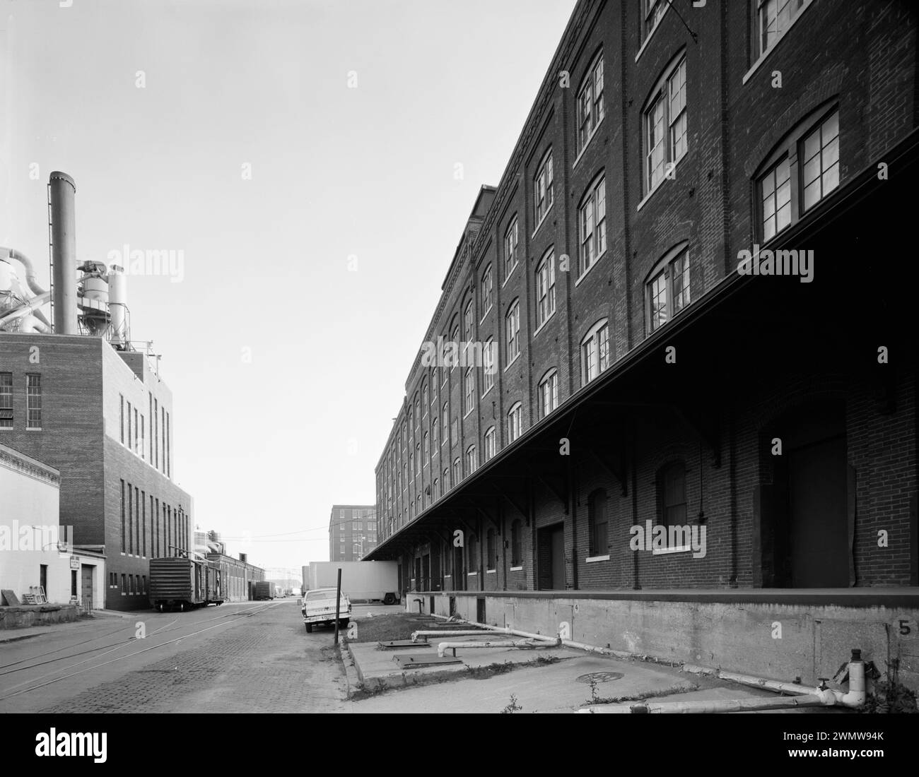 Block of Jackson Street, with Farley and Loetscher Factory in right foreground and Powerhouse in left background. View to South - Dubuque Commercial & industrial Buildings Stock Photo