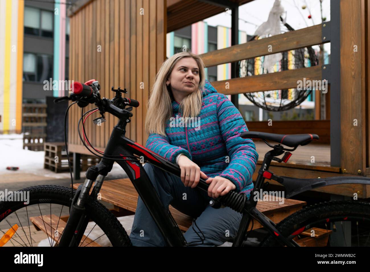 Nice young woman rented a bicycle Stock Photo