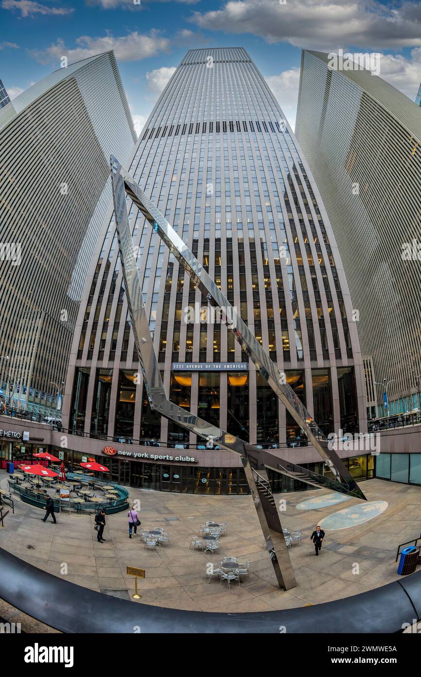 NEW YORK, USA - MARCH 6, 2020: Midtown Manhattan skyscrapers located at 1221 Avenue of the Americas. Subway station and modernist artwork in front. Stock Photo