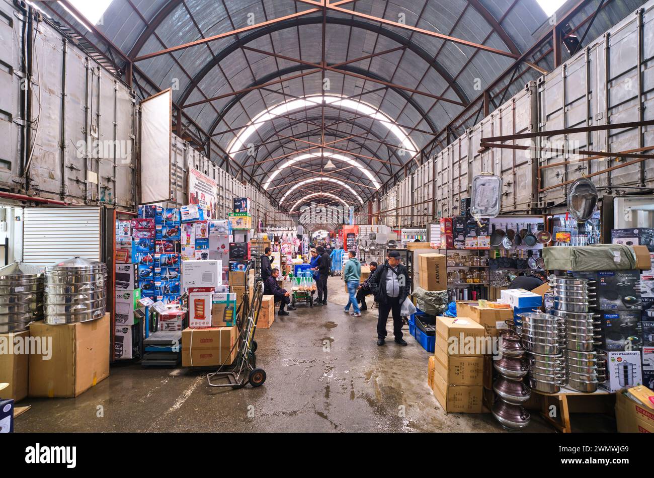 A view down a typical aisle, row, filled with vendors, shops, stores