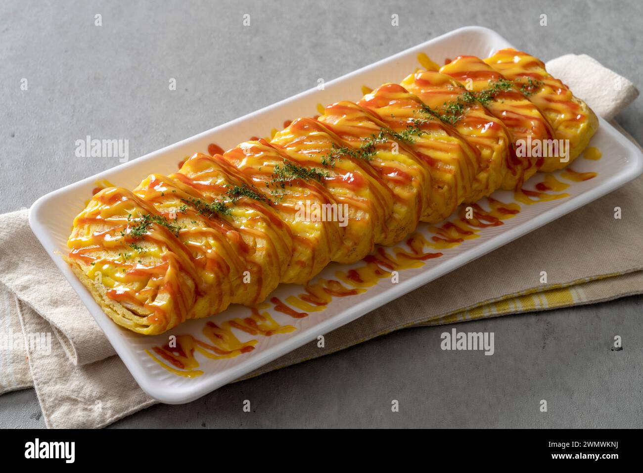 Korean food dish Grilled pork kimchi, potato pancake, egg roll, kimchi