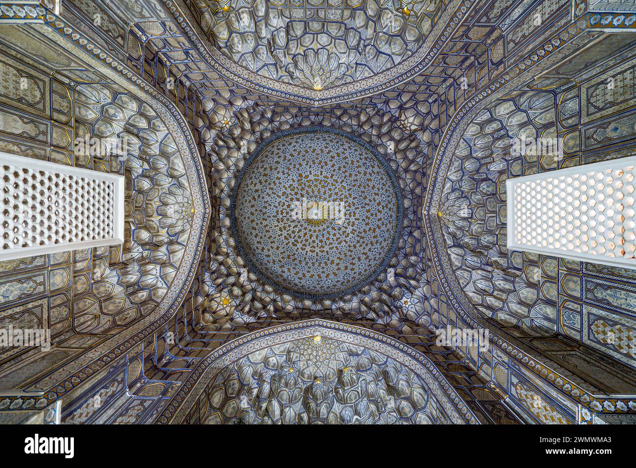 The ceiling inside the crypt or mausoleum is in the traditional Uzbek style. Beautiful interior of the complex Shah-i-Zinda or Shah i Zinda Stock Photo