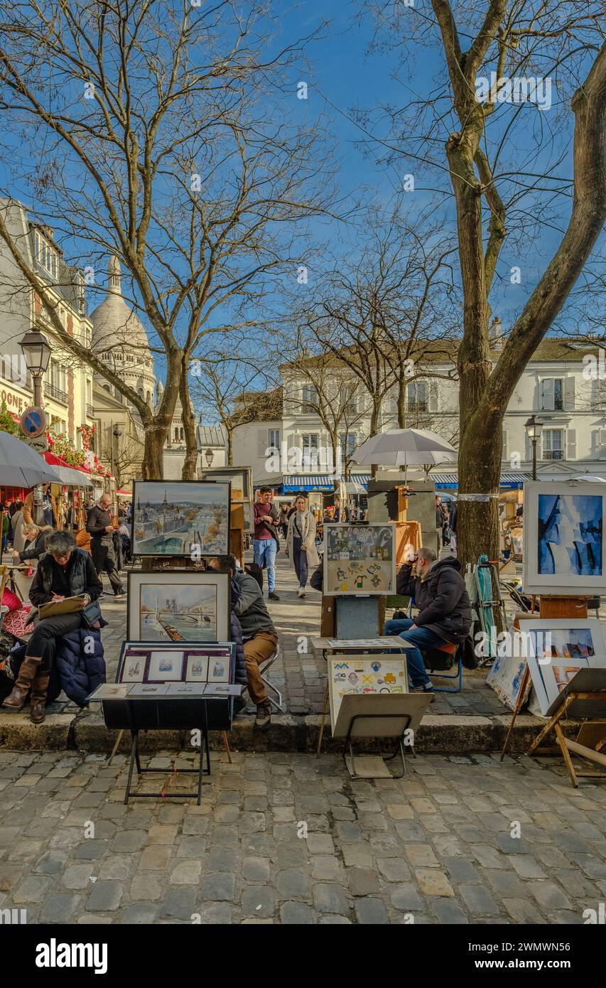 Paris, France - February 17, 2024 : View of the busy and picturesque Montmartre square, famous for artists and restaurants in Paris France Stock Photo