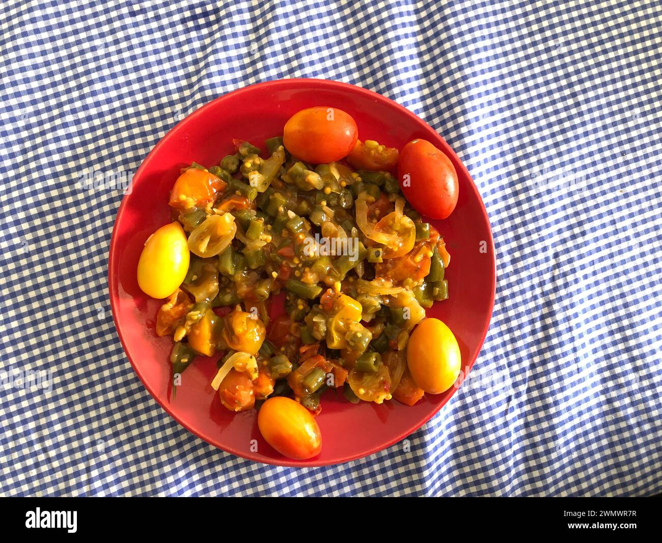 Green bean pods cooked with tomatoes, peppers and onions, a typical Brazilian recipe Stock Photo