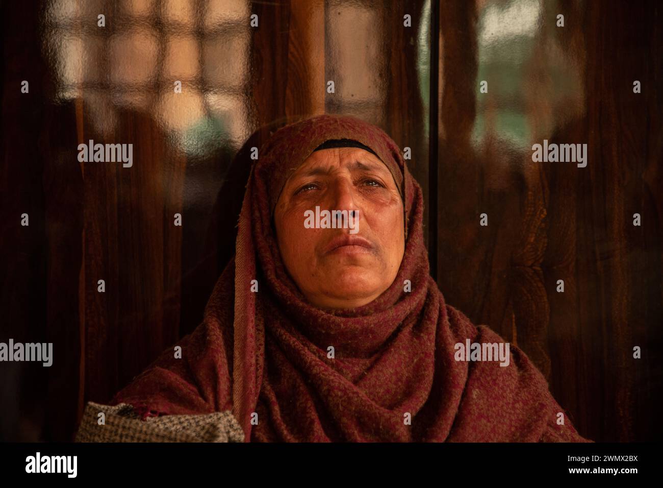 Mother of Azad Yousuf Kumar, grieves at her home in Pulwama 