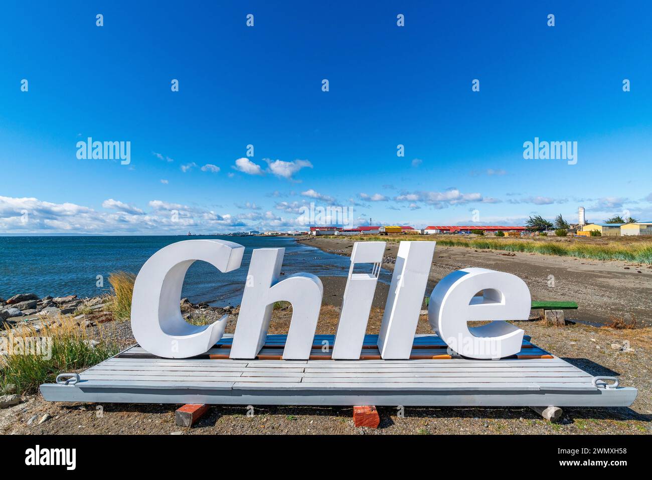 Huge letters form the word Chile on the beach of the Strait of Magellan