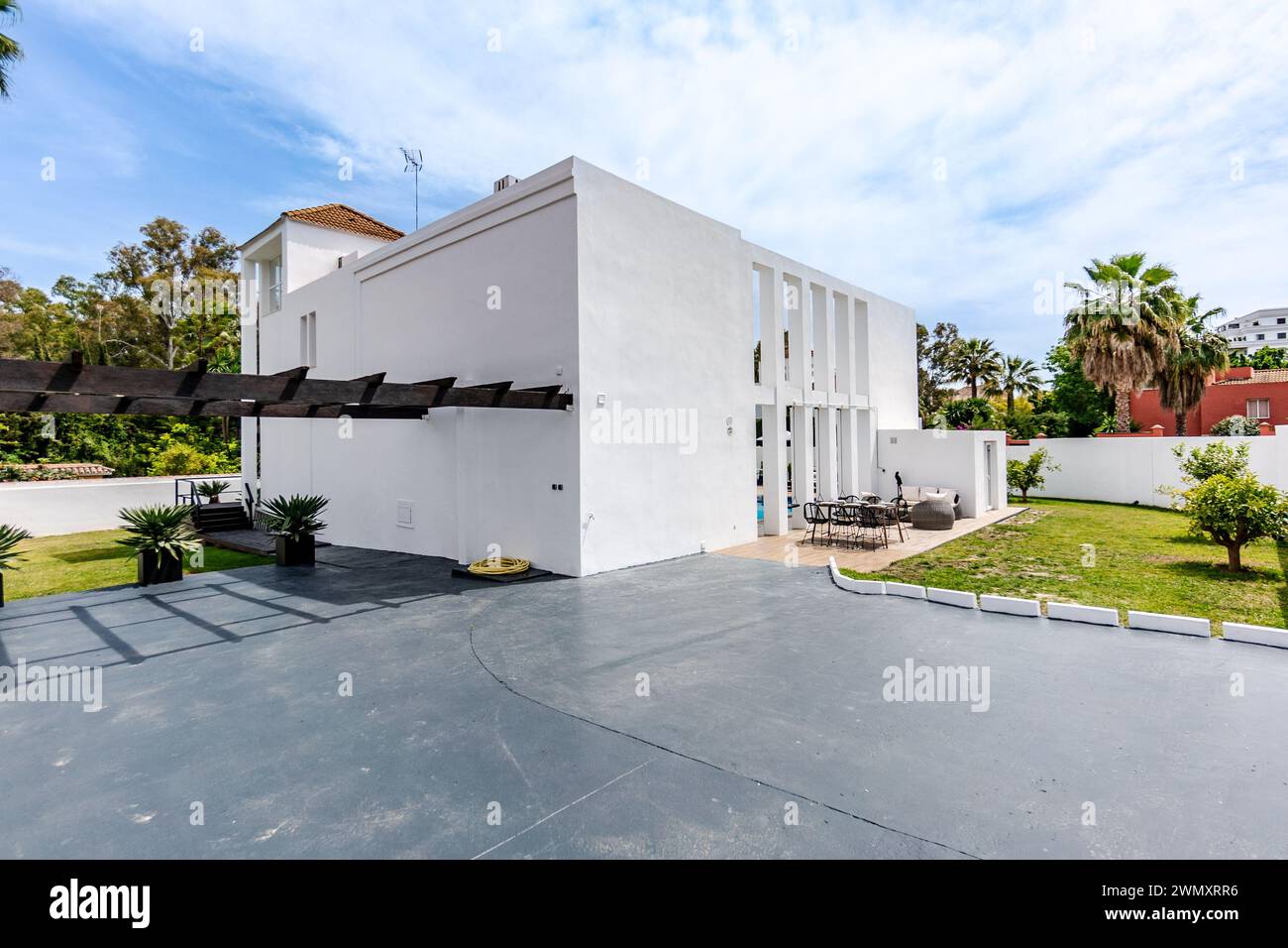 Photo inspiration: Fresh Look at The Private Parking Area For Multiple Vehicles Behind A Luxury