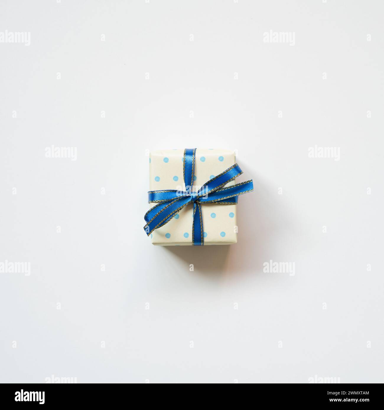 Blue dot pattern ivory gift box isolated on white background. top view Stock Photo