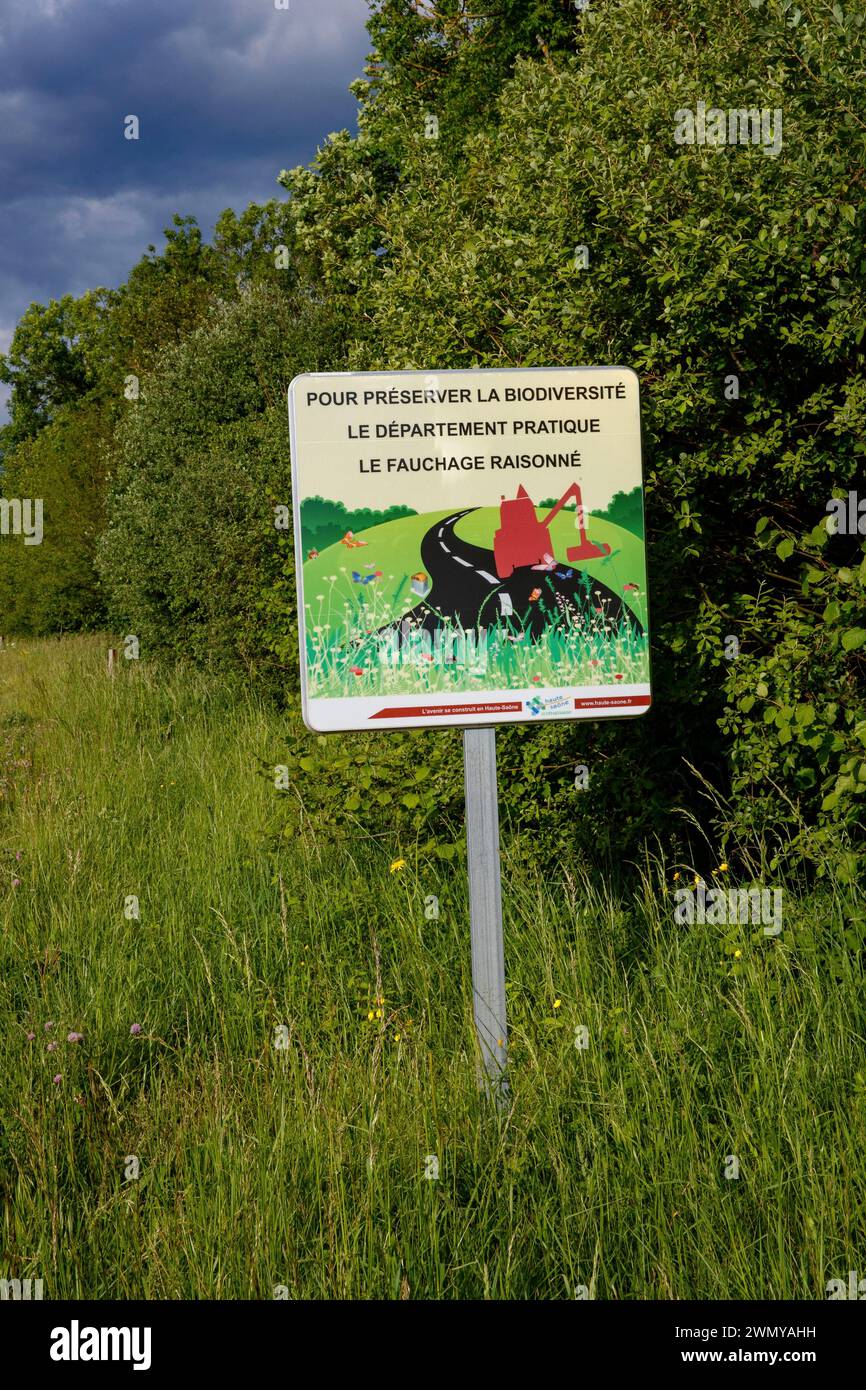 France, Haute Saône, Sign warning of late mowing of roadsides to preserve biodiversity Stock Photo