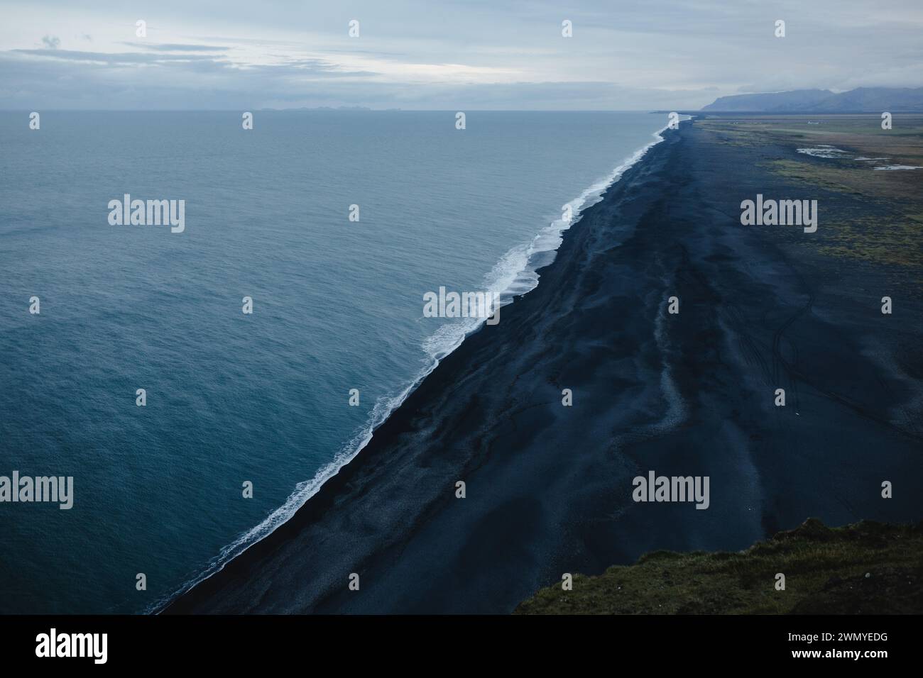 Aerial view capturing the stark beauty of Iceland's black sand beaches ...