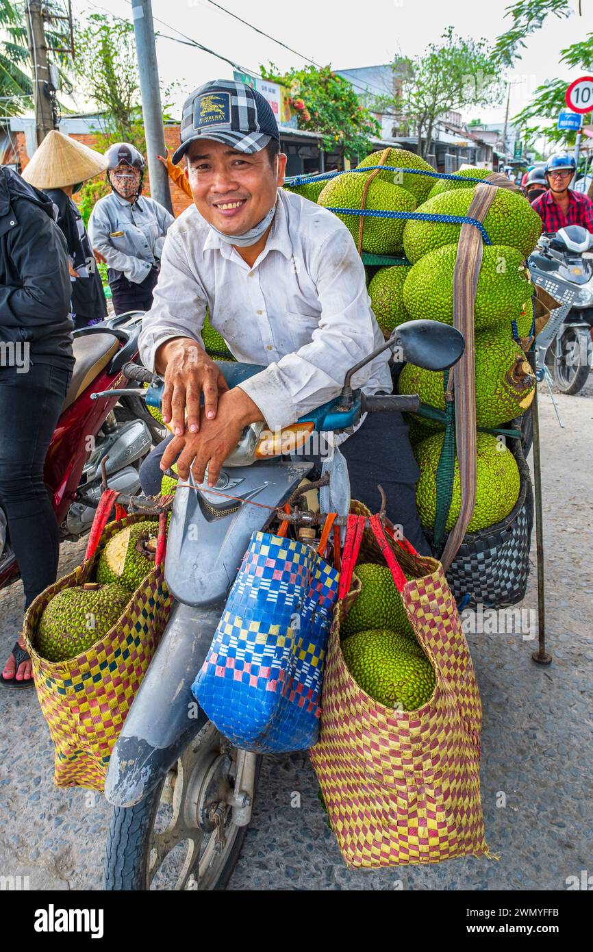 Vietnam, Mekong Delta, Cai Be, scooter loaded with jackfruits Stock Photo