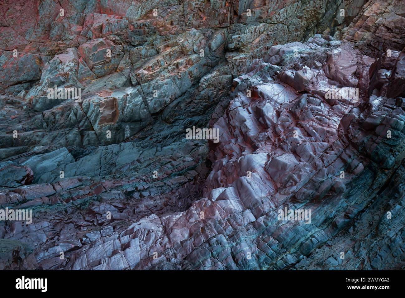 Vibrant textured rocks at Llumeres, Asturias, displaying biofilm ...