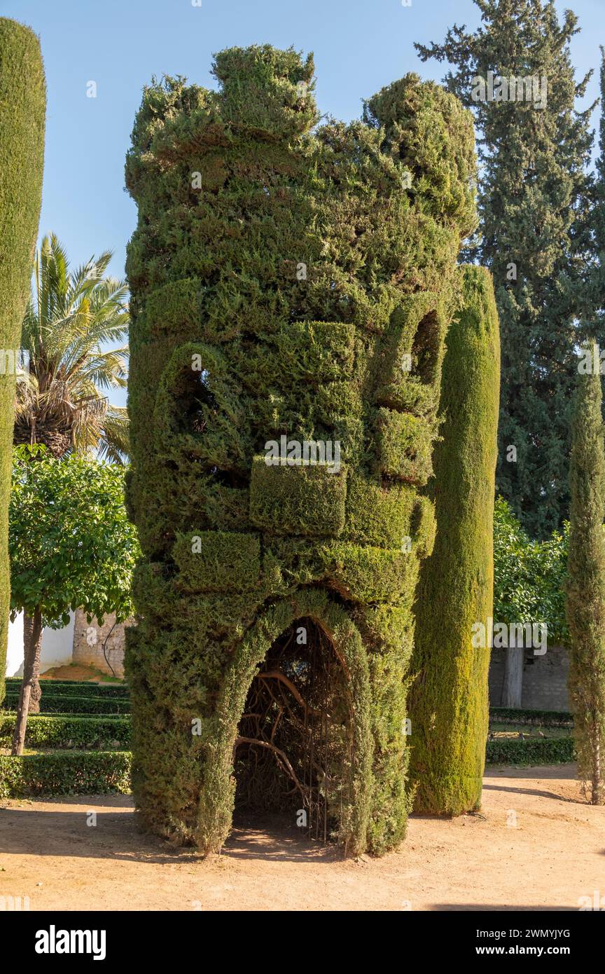 A cypress hedge shaped as a playhouse for children in the grounds at the Alcazar de los Reyes Cristianos, also known as the Alcazar of Cordoba, is a m Stock Photo