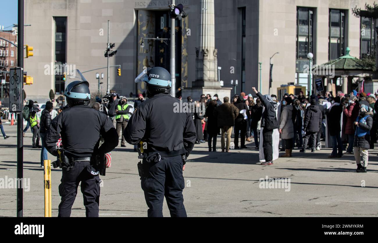 Library National Police NYPD police officers observe free Gaza Palestinian protest in front of ...