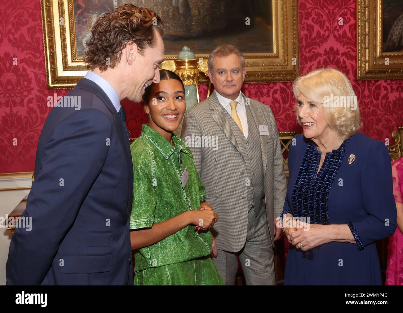 Queen Camilla speaks with Tom Hiddleston, Olivia Dean and Hugh
