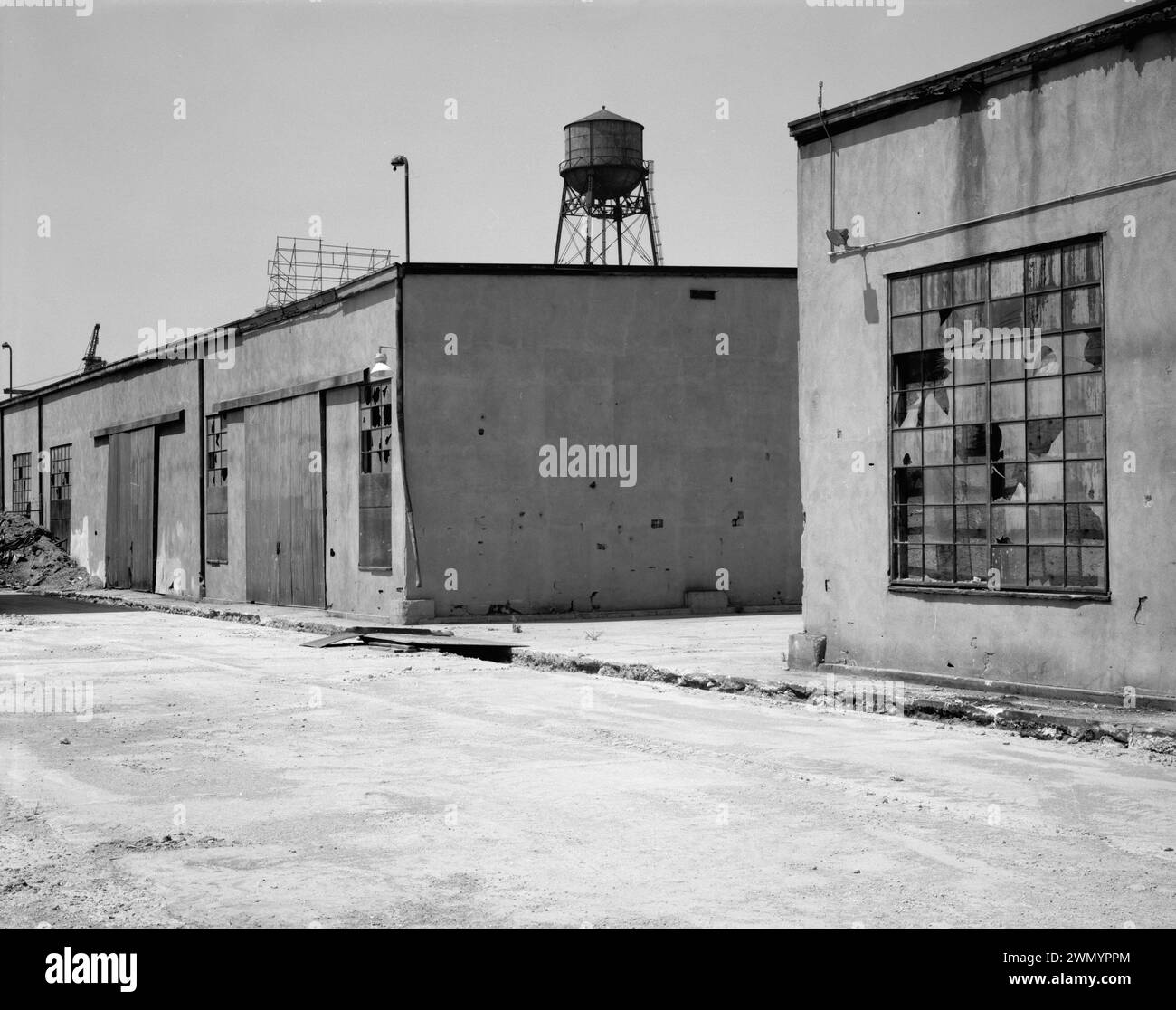 Industrial area - vintage building - Warehouse -  EAST SIDE DETAIL OF SHEDS C AND D. VIEW TO SOUTHWEST. - Ford Motor Company Long Beach Assembly Plant, Sheds C and D, 700 Henry Ford Avenue, Long Beach, Los Angeles County Stock Photo