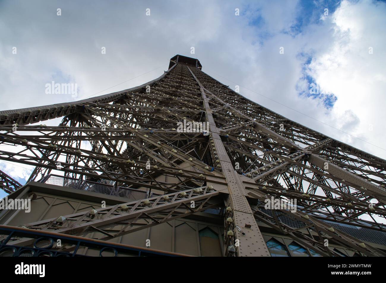 A beautiful Eiffel tower in Paris, France with cloudy sky in the backdrop. Stock Photo