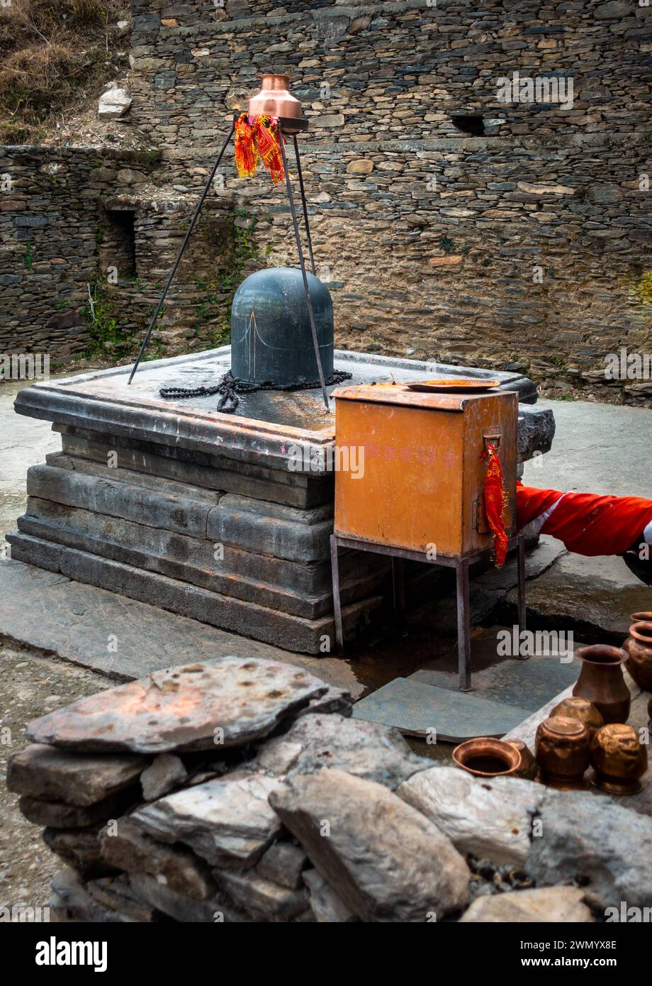 Feb.18th 2024, Uttarakhand India. Granite stone Shivalinga's at Lakhamandal Shiva Temple. It shines like a mirror and reflects the surrounding view. Stock Photo